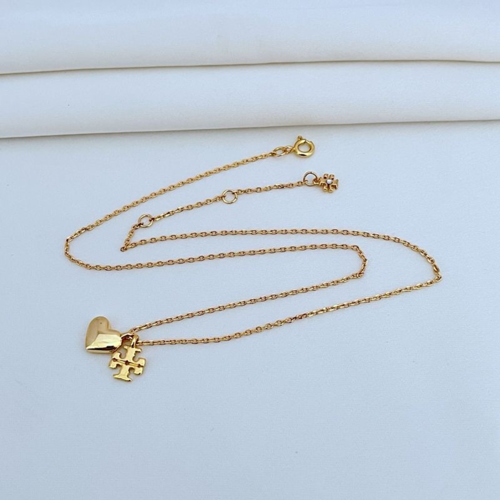 Tory burch Gold Heart and Puzzle Pendant Necklace - Picture 4 of 10